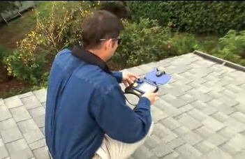 Technician performing a rooftop solar site survey