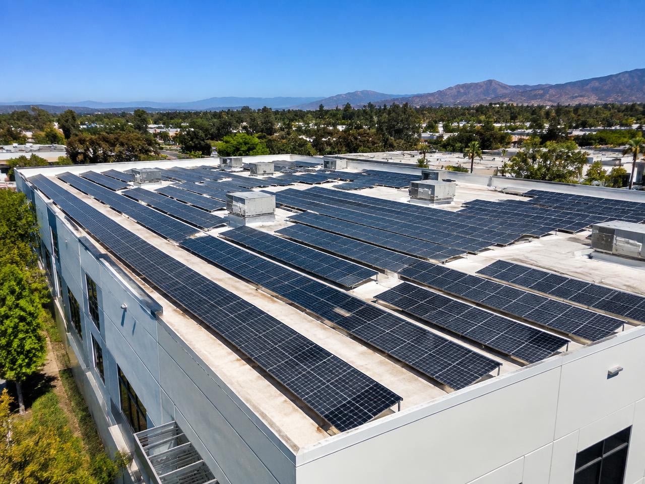 Large commercial rooftop solar array on a Southern California business building